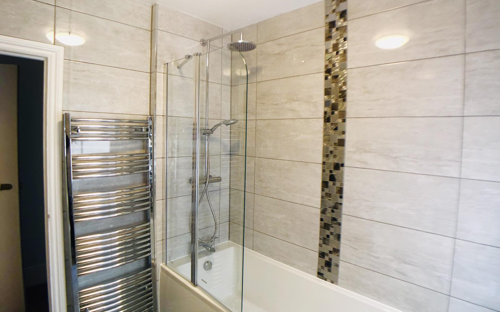 En-suite bathroom with bath and shower