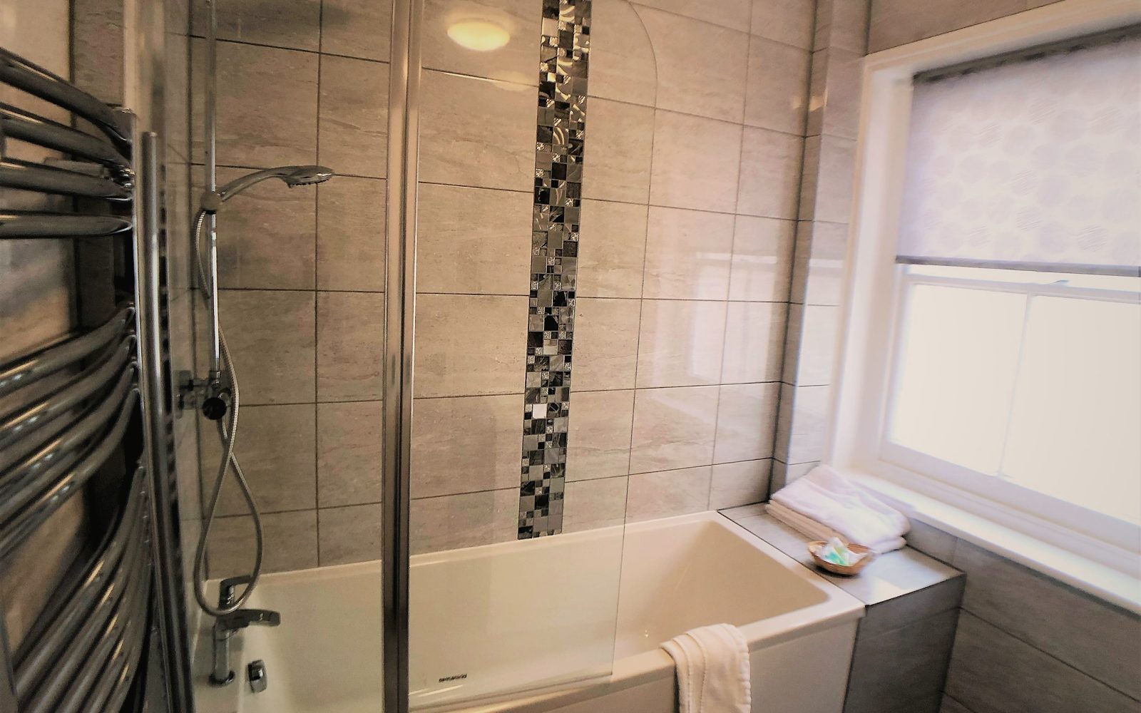 Bathroom with bath and shower