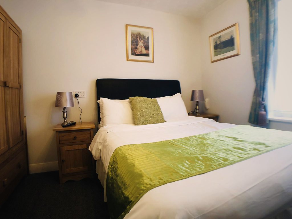 Double room with sage bed runner