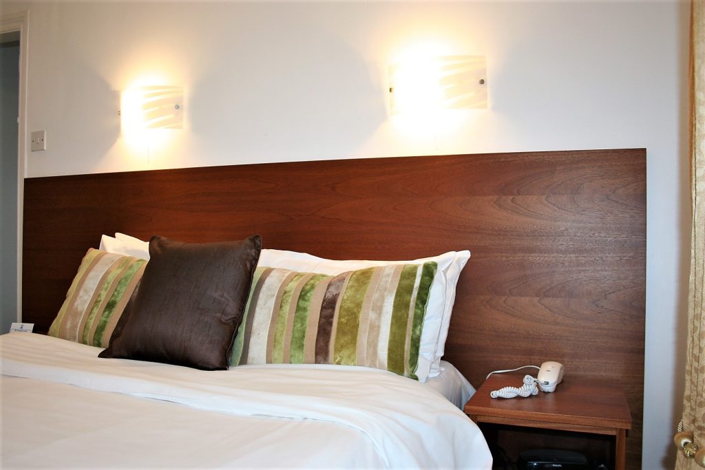 Double bed with crisp white linen