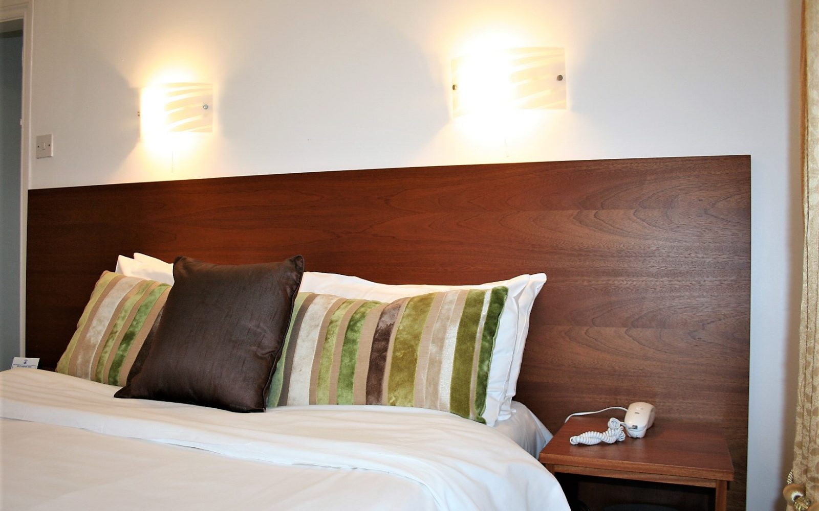 Double bed with crisp white linen
