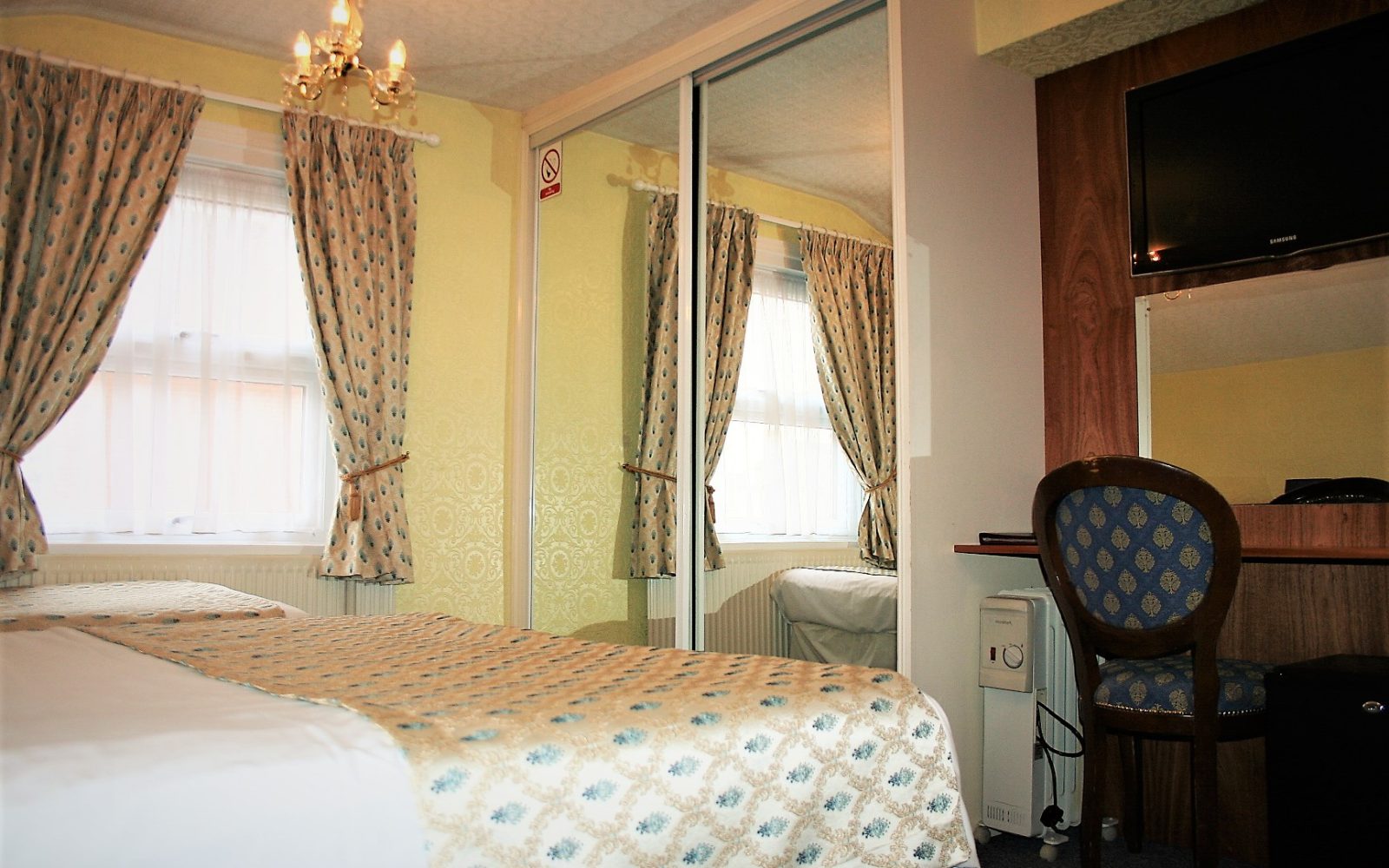 Double room with dressing table and wardrobe