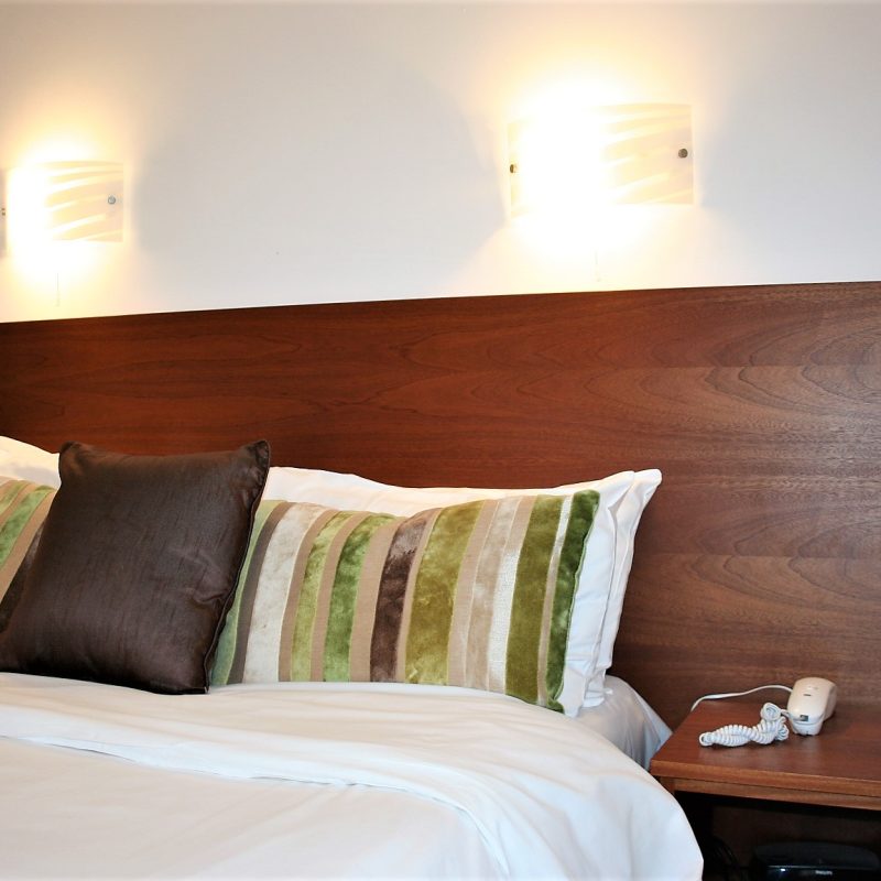 Double bed with crisp white linen